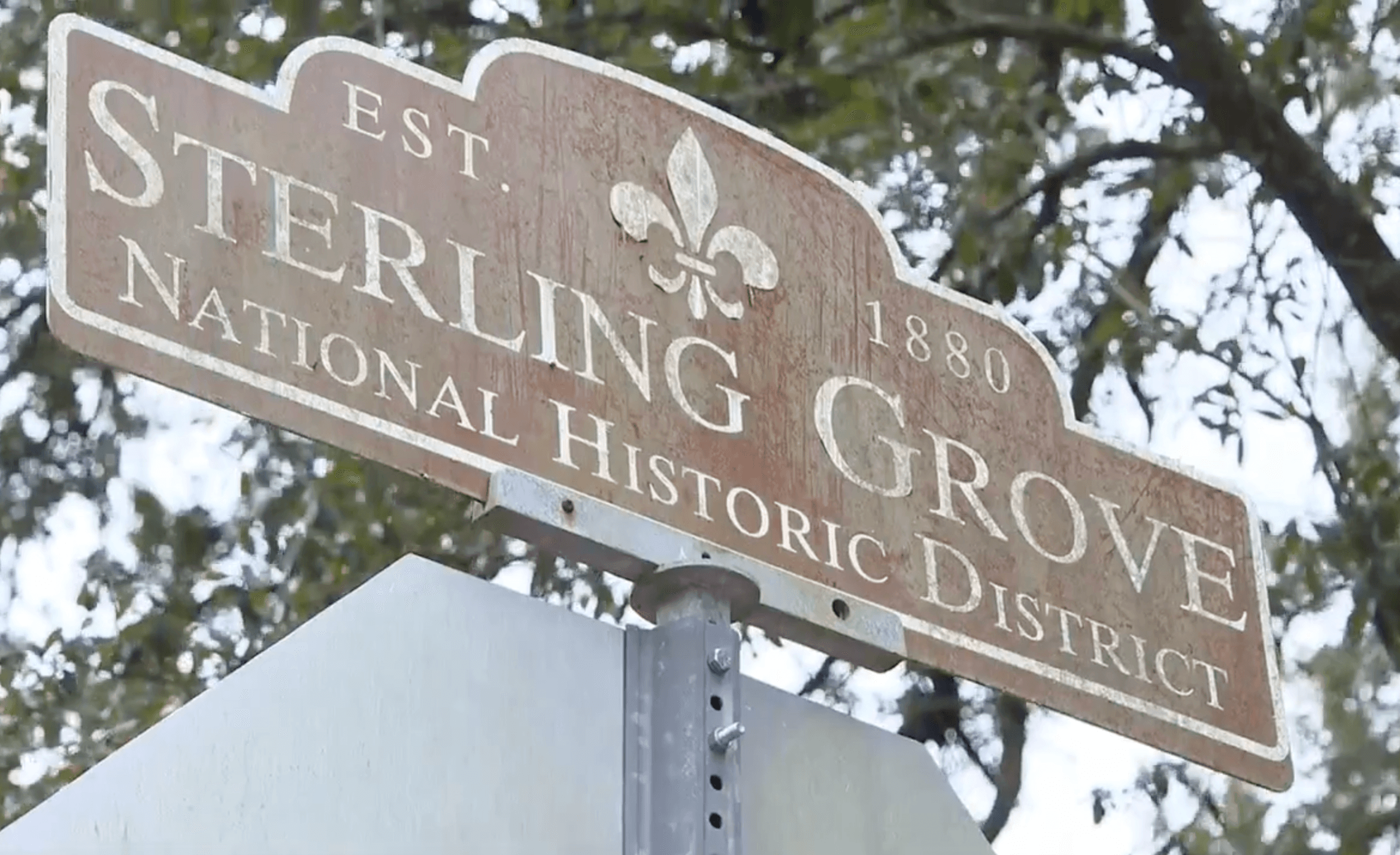 Weathered sign for Sterling Grove National Historic District, established in 1880.